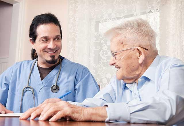 Healthcare provider working with a geriatric patient.