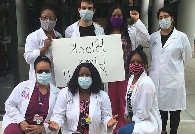 Staff standing in solidarity for Black lives.