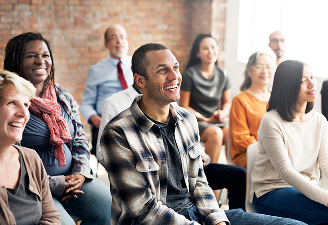 people sitting down in a learning space