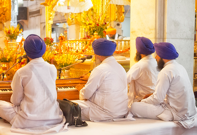 men praying and singing