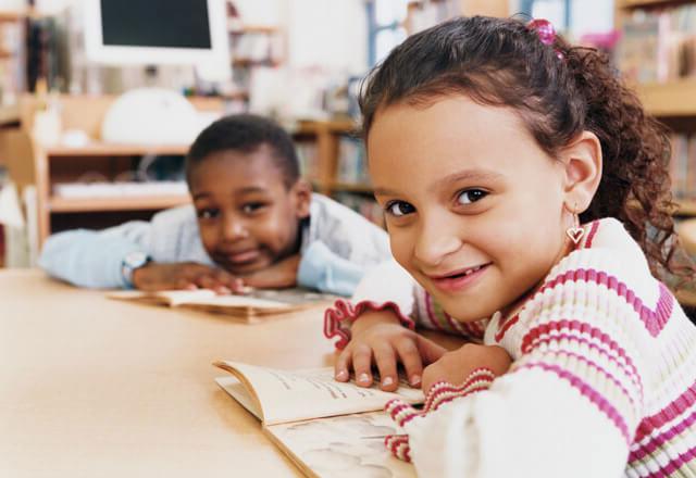 boy and girl at a desk