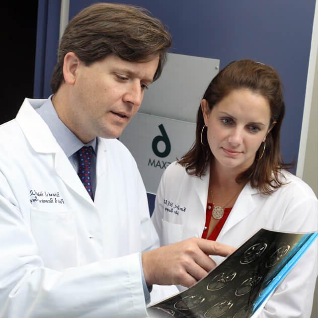 Dr. Redett and Dr. Seifert review an X-ray.