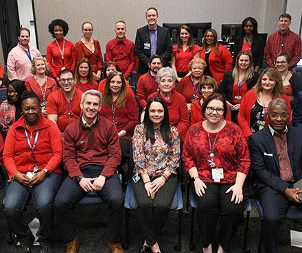 employees of hopkins wearing red