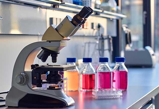 Microscope and test liquids on the table