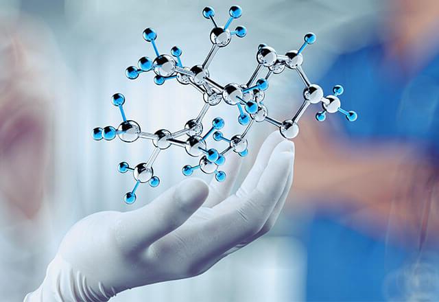 hand holding molecules