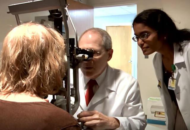 Wilmer doctors observe a patient during exam