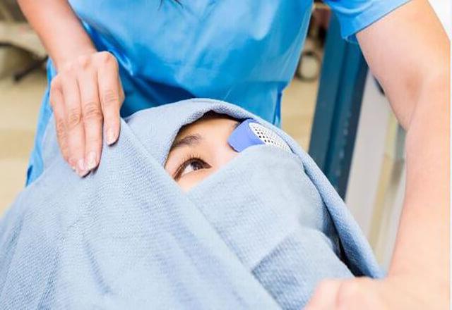 a patient prepares to have eye surgery